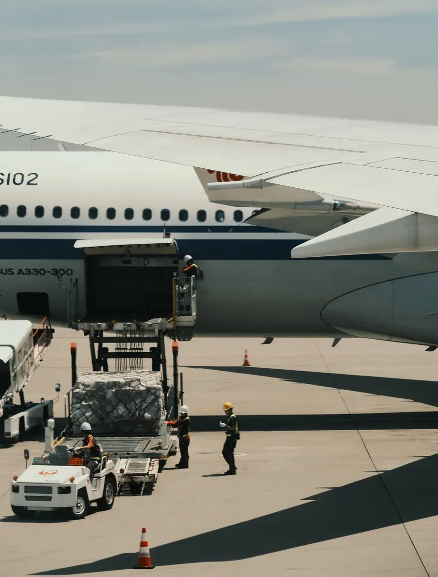 Cargo being loaded into a passenger jet on the apron
