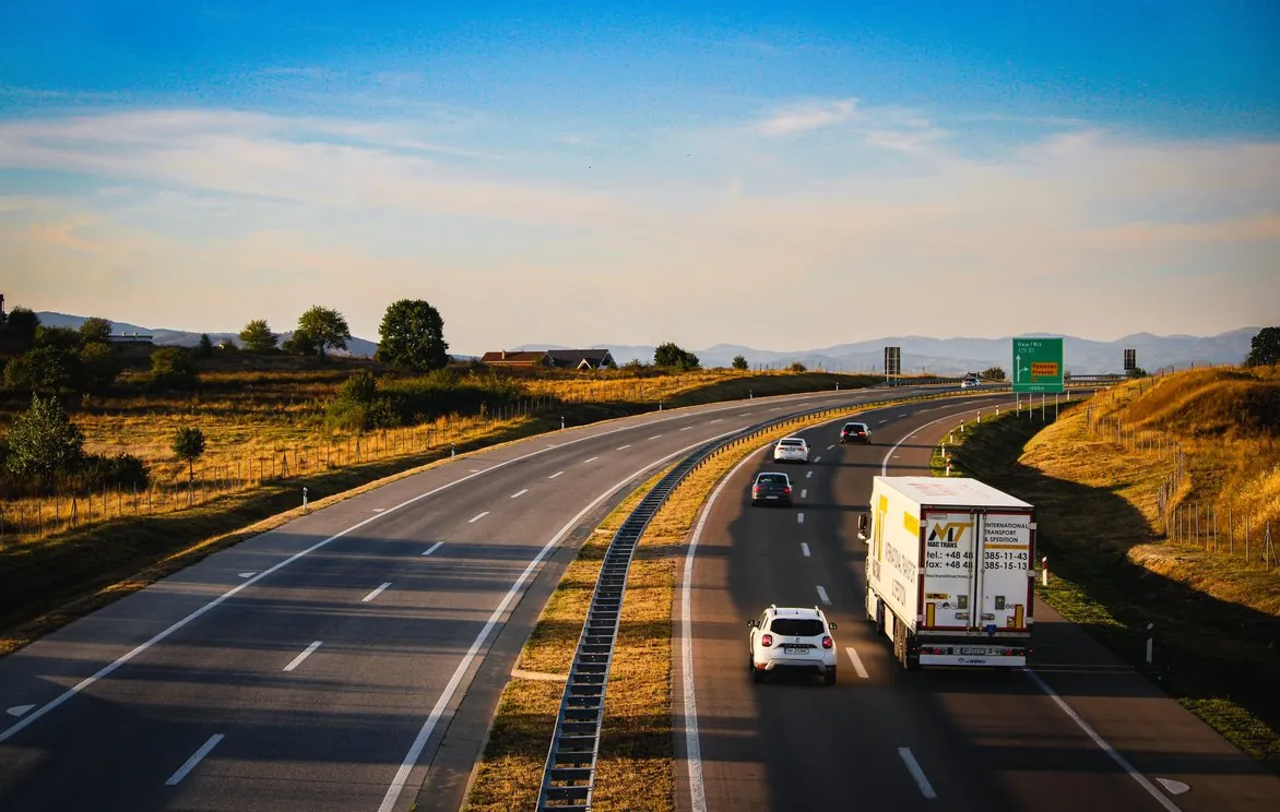 Lorry on a motorway through open countryside