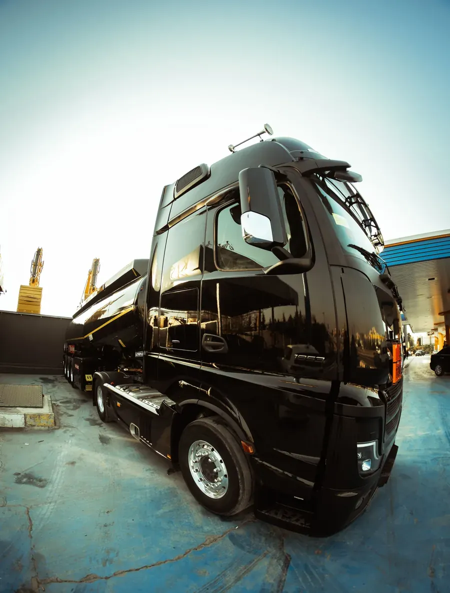 Black lorry at a loading bay